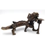 An Antique Chinese Bronze Dragon Candle Holder. Excellent detail and expression - a very unusual