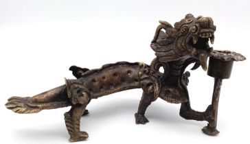 An Antique Chinese Bronze Dragon Candle Holder. Excellent detail and expression - a very unusual