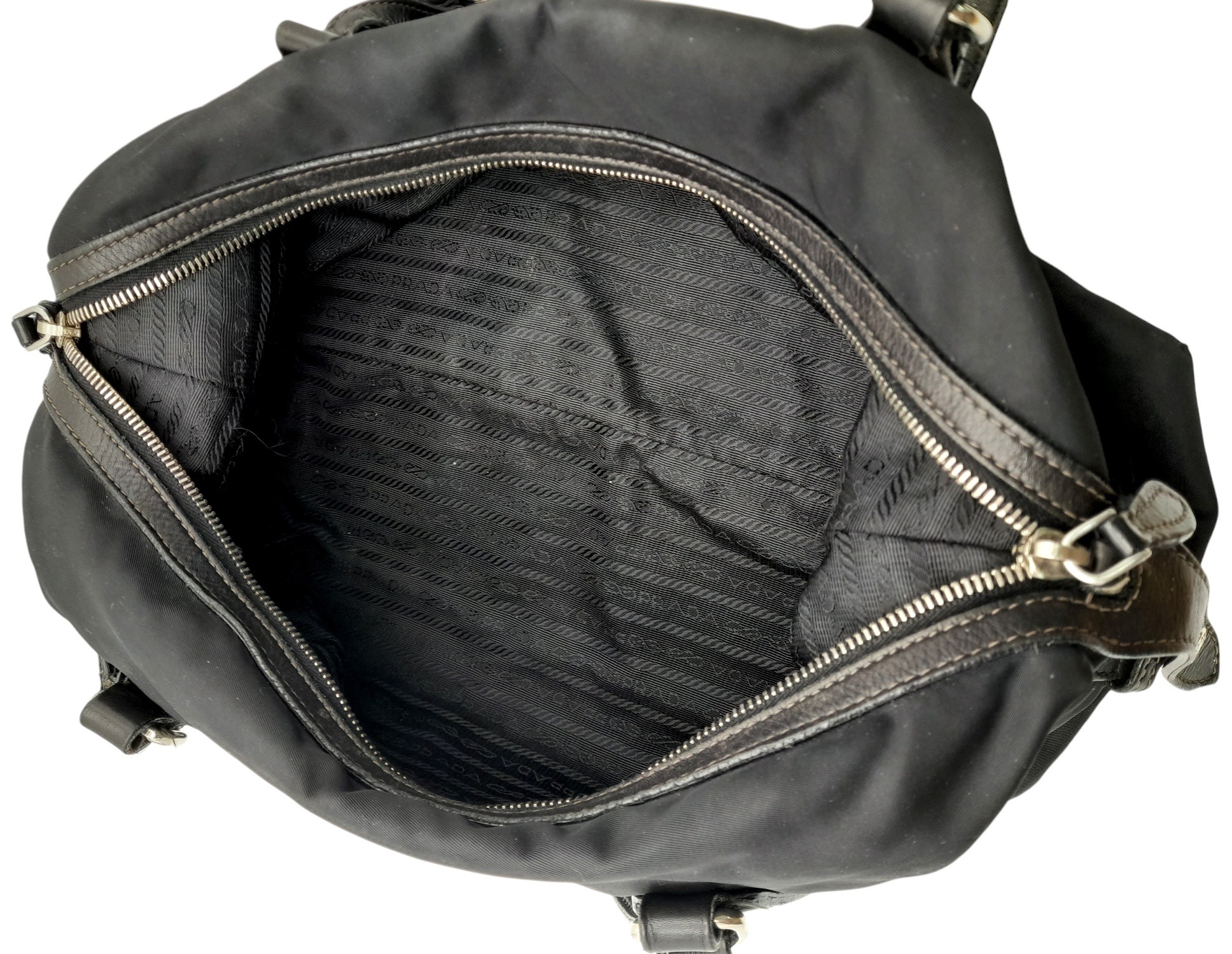A Prada Black Tessuto Satchel. Textile exterior with leather trim, silver-tone hardware, a top zip - Image 4 of 7