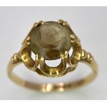 A 9K Yellow Gold Smoky Quartz Ring. Size P. 2.2g total weight.