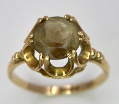 A 9K Yellow Gold Smoky Quartz Ring. Size P. 2.2g total weight.