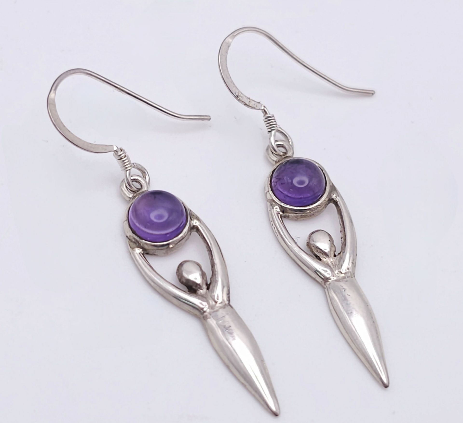 A Pair of Sterling Silver and Amethyst Cabochon ‘Goddess’ Earrings. 4.5cm Drop. Set with 6mm Round
