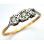 An antique 18 K yellow and white gold ring with a trilogy of diamonds, size: S, weight: 2.3 g.