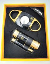 A highly collectable COHIBA lighter and cigar cutter set. This is a commemorative, limited edition