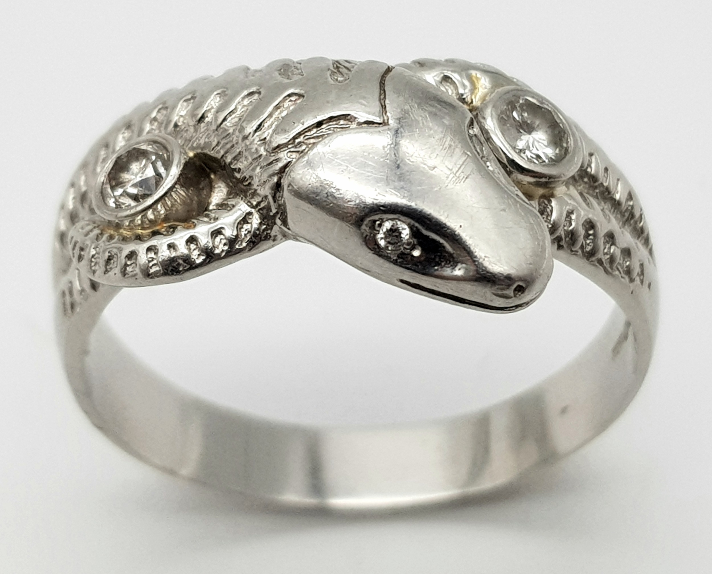 A Very Large 950 Platinum and Diamond Snake Ring. A coiling serpent with diamond eyes and body. Size - Image 2 of 5