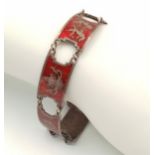 A STERLING SILVER INDIAN RED ENAMELLED BRACELET -FEATURING VARIOUS GODS. 20.3G