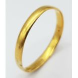 A 22K GOLD BAND RING . 2.5gms size W