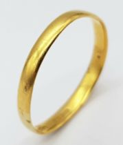 A 22K GOLD BAND RING . 2.5gms size W