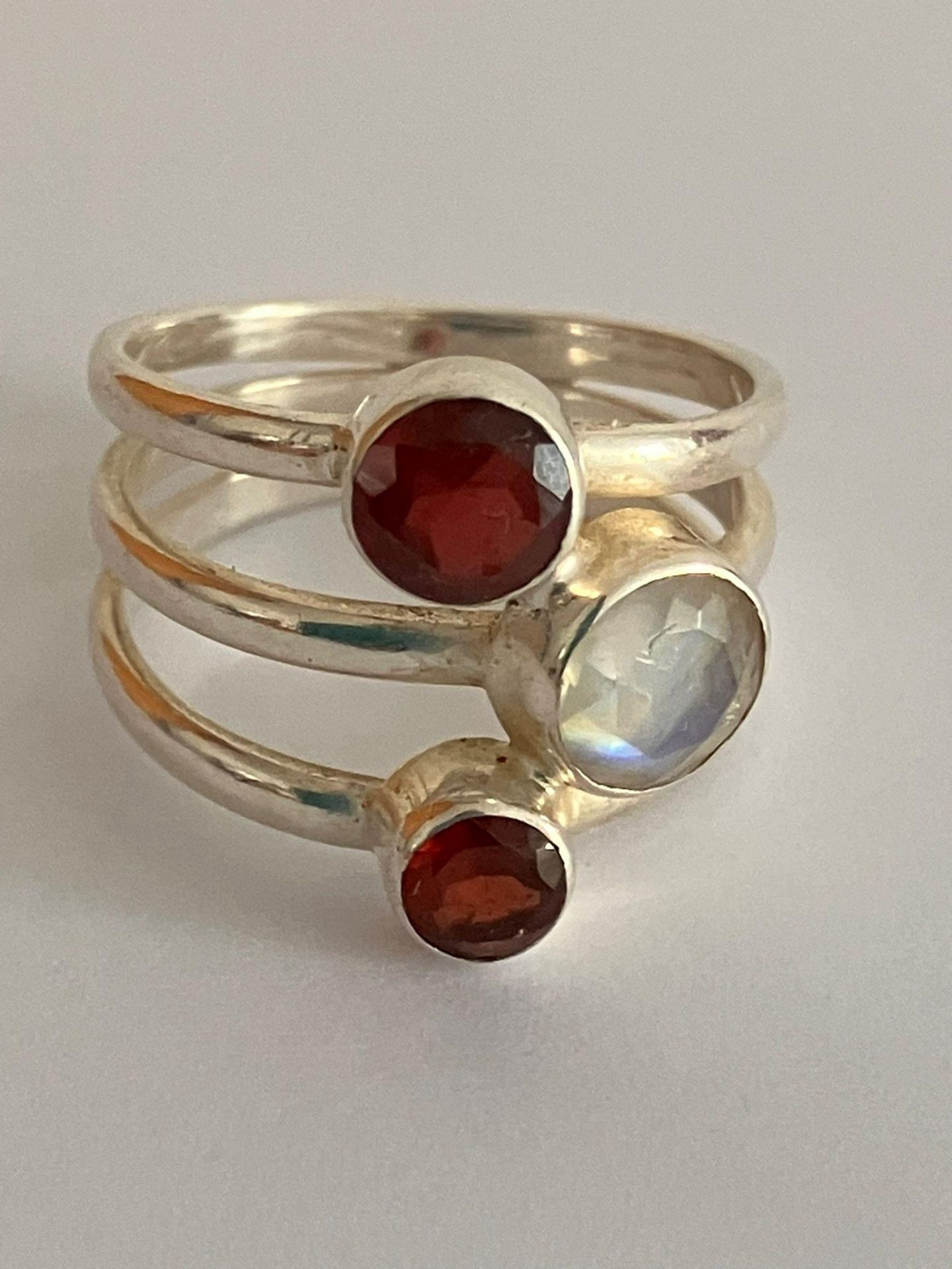 Vintage SILVER RING with ‘triple band’ design. Set with GARNETS and MOONSTONE.Full UK Hallmark.
