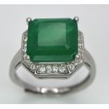 A 925 Green stone Ring. White stone decoration. Expandable. Size N.