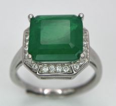 A 925 Green stone Ring. White stone decoration. Expandable. Size N.