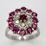 A Gorgeous 18K White Gold, Ruby and Diamond Ring. Floral design on an elevated setting. 14 rubies