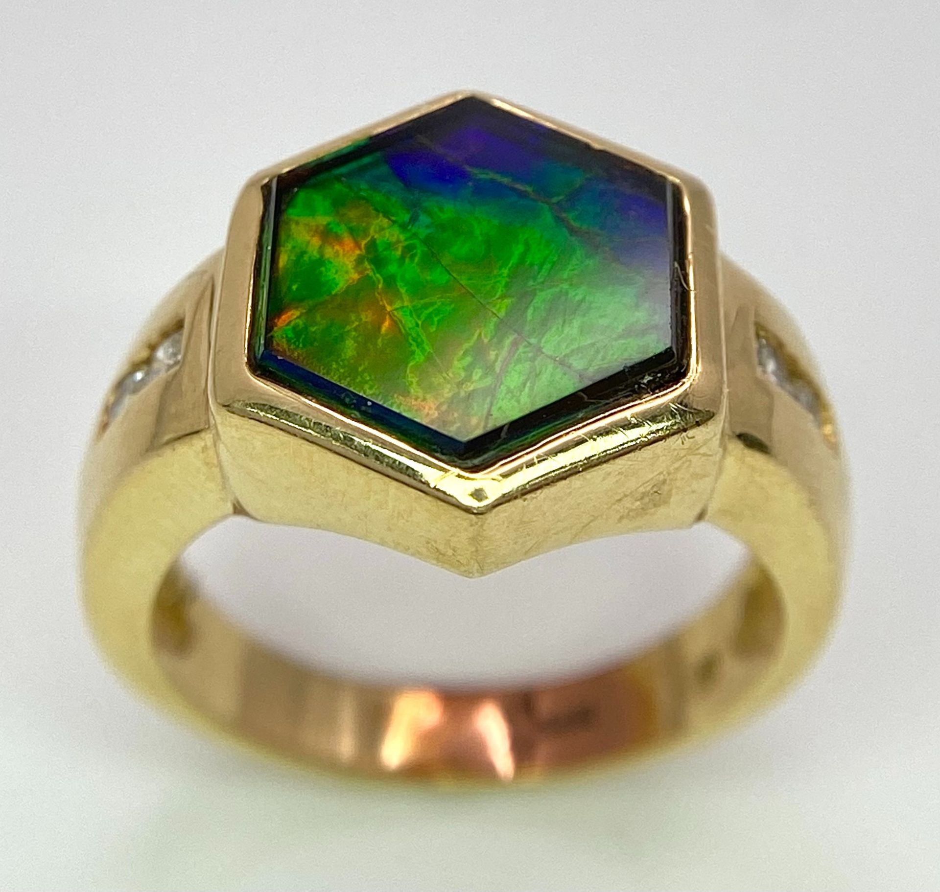 A Very Different, 14K Gold, Ammolite and Diamond Ring. Hexagonal shape. Size L. 6.3g total weight.