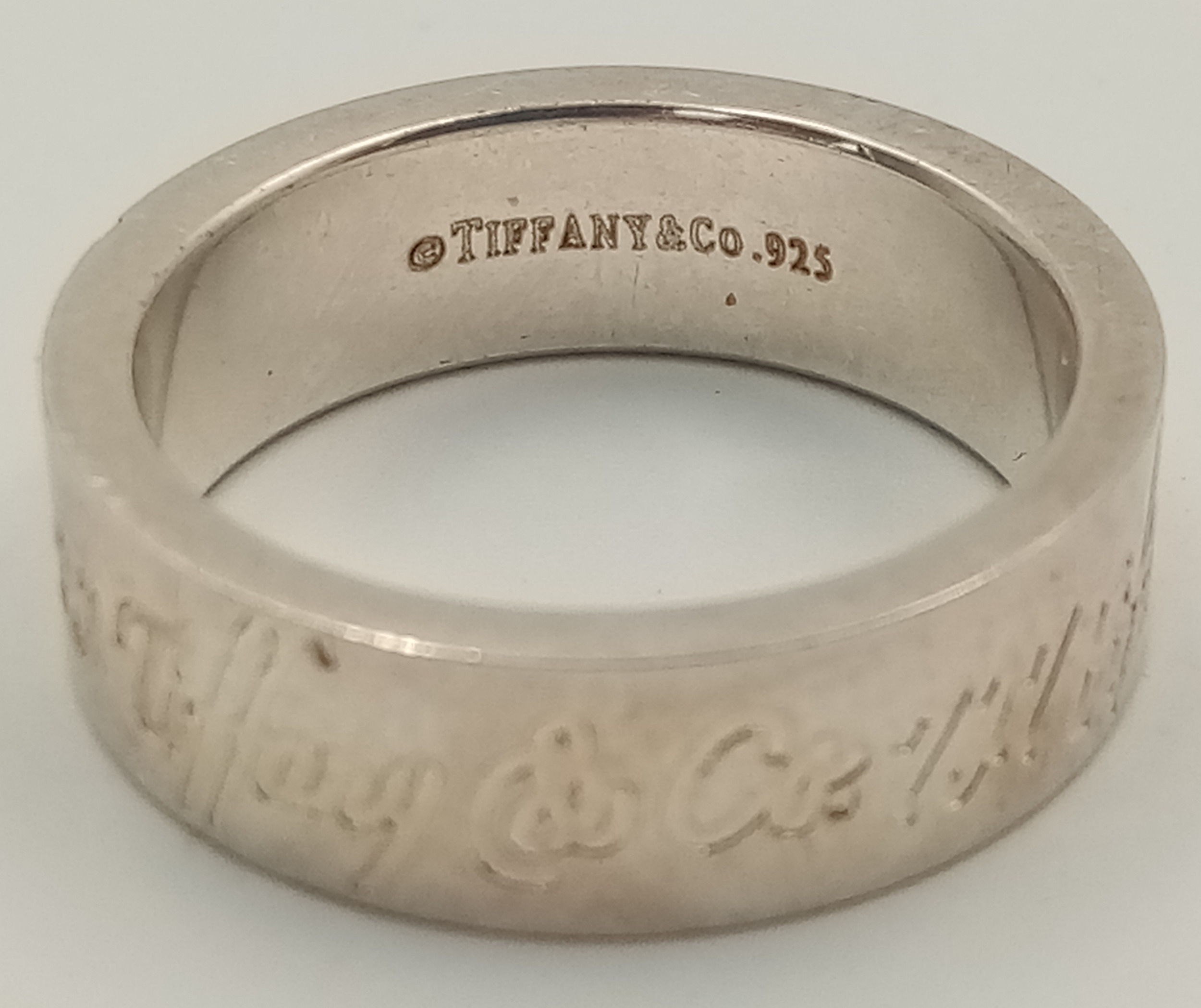A TIFFANY & CO STERLING SILVER BAND RING, 727 NEW YORK FIFTH AVENUE. Size N, 5g total weight. Ref: - Image 2 of 5