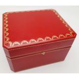 A Cartier Watch Case. Red exterior, plush black textile interior. For a large watch.