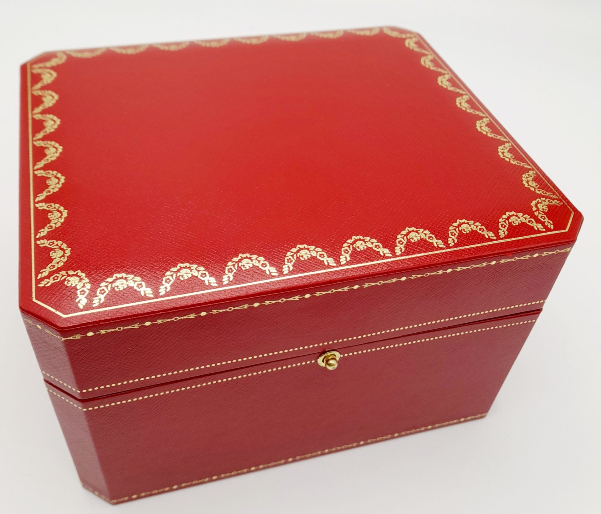 A Cartier Watch Case. Red exterior, plush black textile interior. For a large watch.