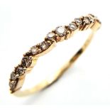 A 9K YELLOW GOLD DIAMOND SET WAVY BAND RING. 0.35ctw, Size N, 1.5g total weight. Ref: SC 8033