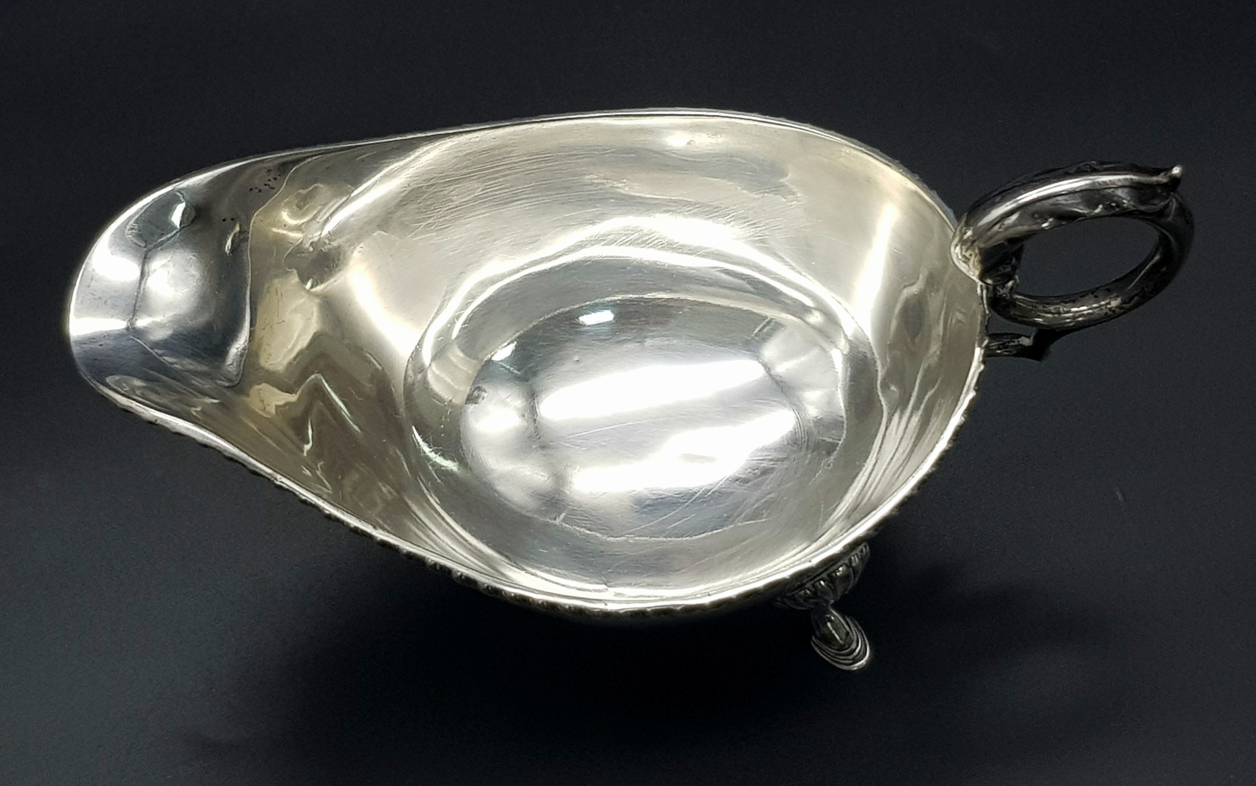 An Almost Antique Sterling Silver Gravy Boat. Scroll handle and shell decorative legs. Hallmarks for - Image 5 of 6