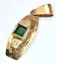 An 18K Yellow Gold and Emerald Pendant. 22mm. 1g