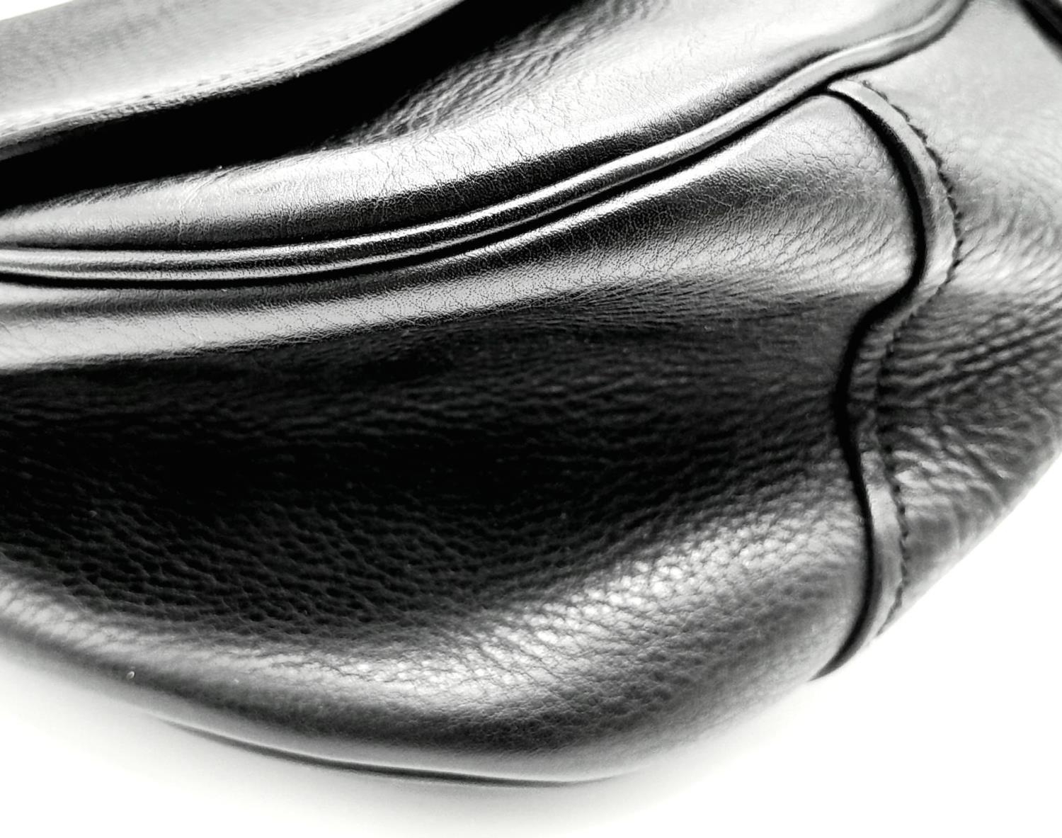 A Prada Black Leather Crossbody Satchel Bag. Textured exterior with buckled flap. Spacious leather - Image 12 of 14