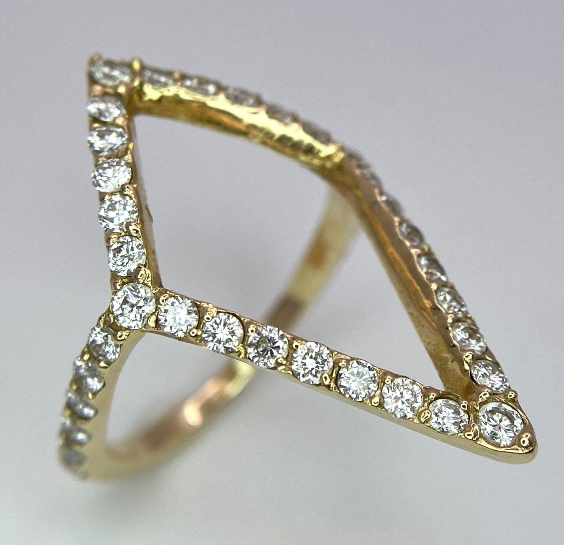 An 18K Yellow Gold (tested) Diamond Trillion Shaped Ring. Size J. 2.6g weight. Ref: 016674