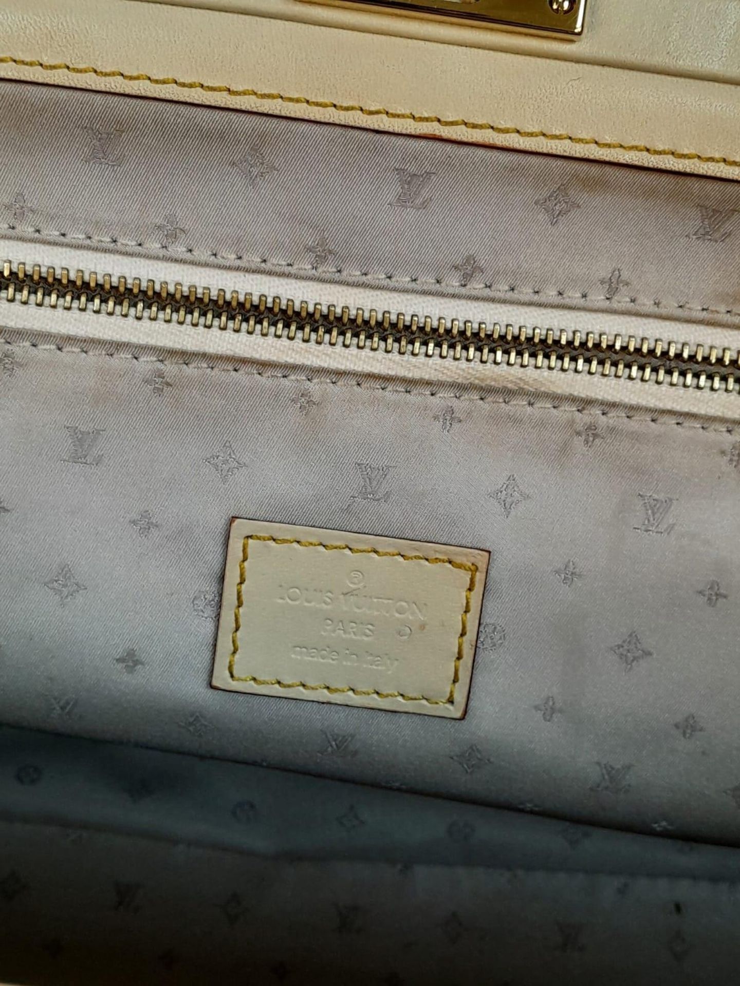 A Louis Vuitton Manhattan PM Suhali Leather Handbag. Soft white textured leather exterior with - Image 9 of 9