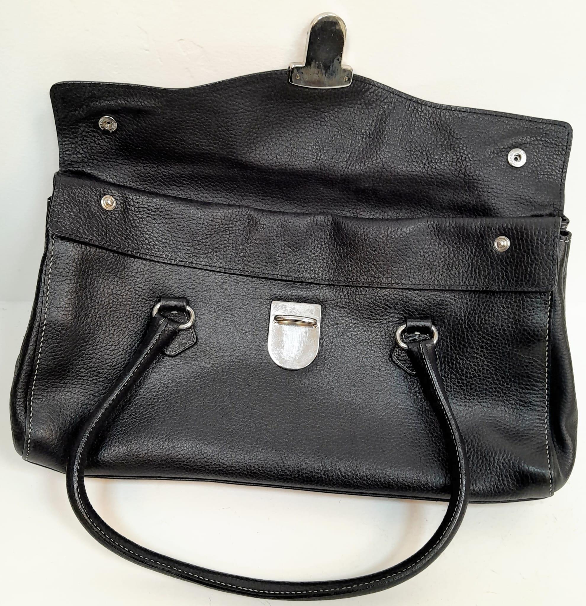 A Prada Black Shoulder Bag. Leather exterior with silver-toned hardware, two rolled leather - Image 5 of 7
