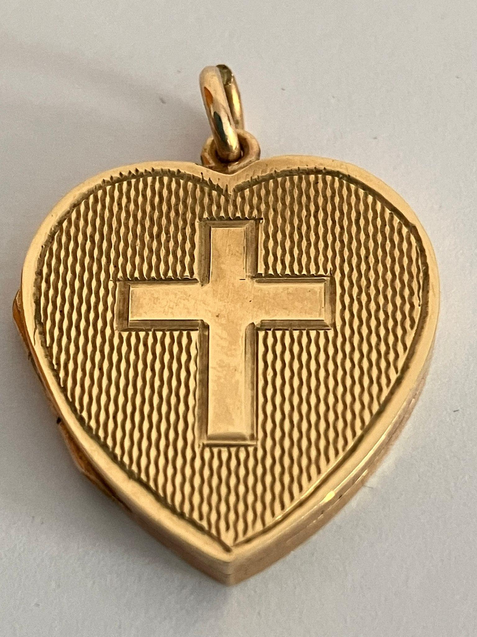 Vintage 9 carat GOLD LOCKET.Front having attractive engine turned design with GOLD CROSS MOTIF to