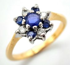 AN 18K YELLOW GOLD DIAMOND AND SAPPHIRE CLUSTER RING. 3.3G. SIZE L