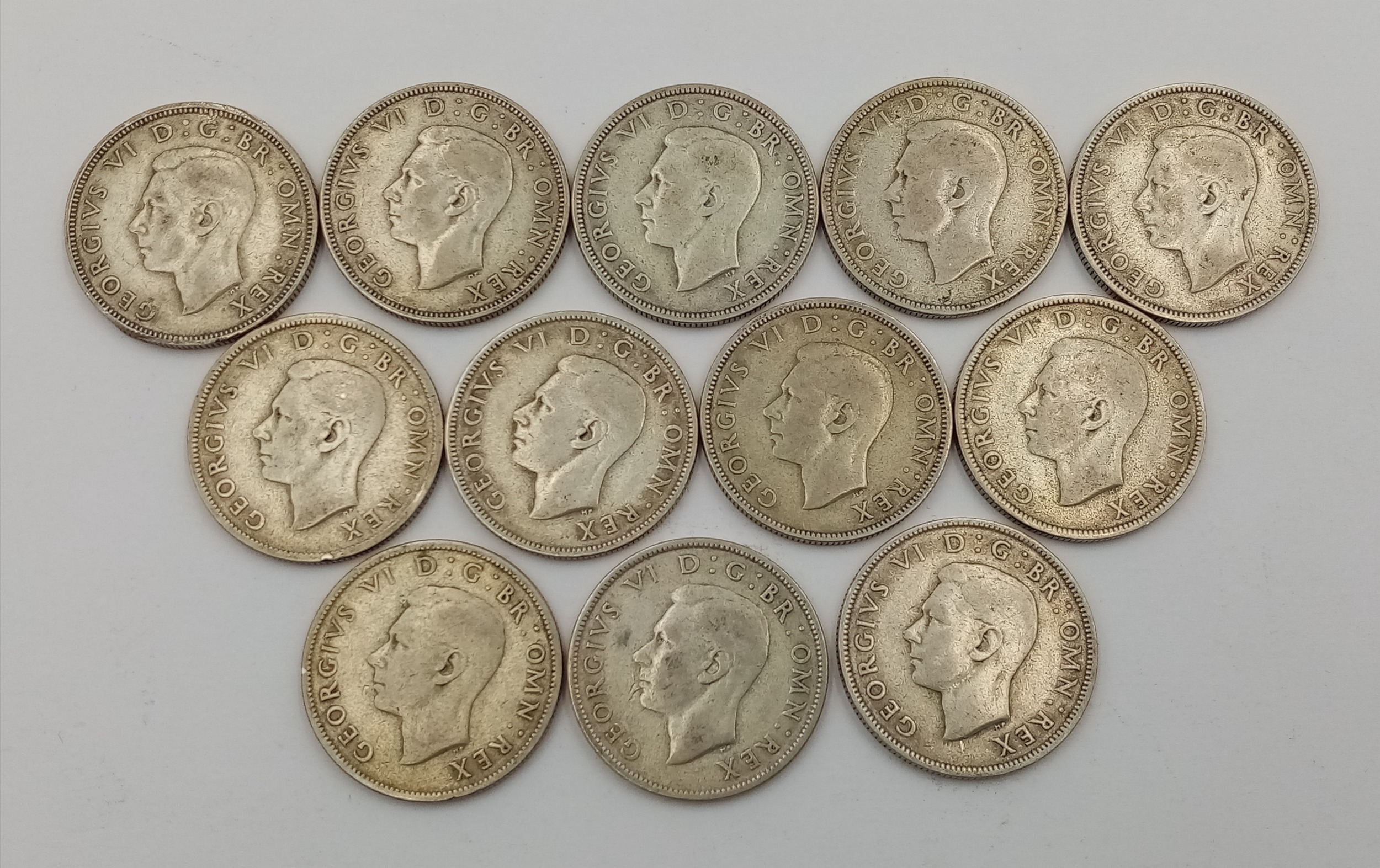 A Parcel of Twelve Pre-1947 Silver Two Shilling (Florin) Coins. Dates: 1 x 1939, 2 x 1940, 2 x 1941,