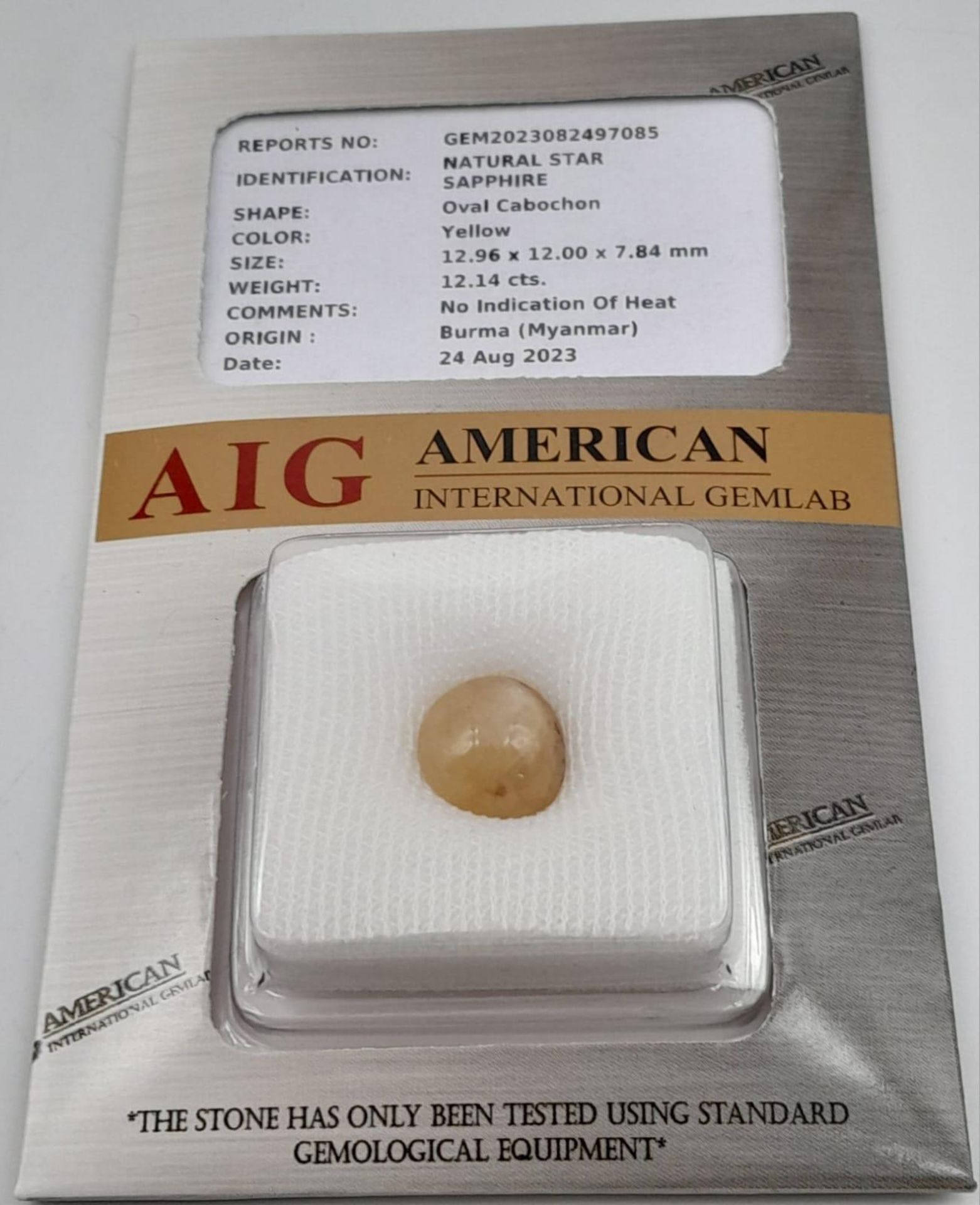 A 12.14ct Untreated Burmese Yellow Sapphire Cabochon Gemstone - AIG Certified in a Sealed Container. - Image 2 of 3