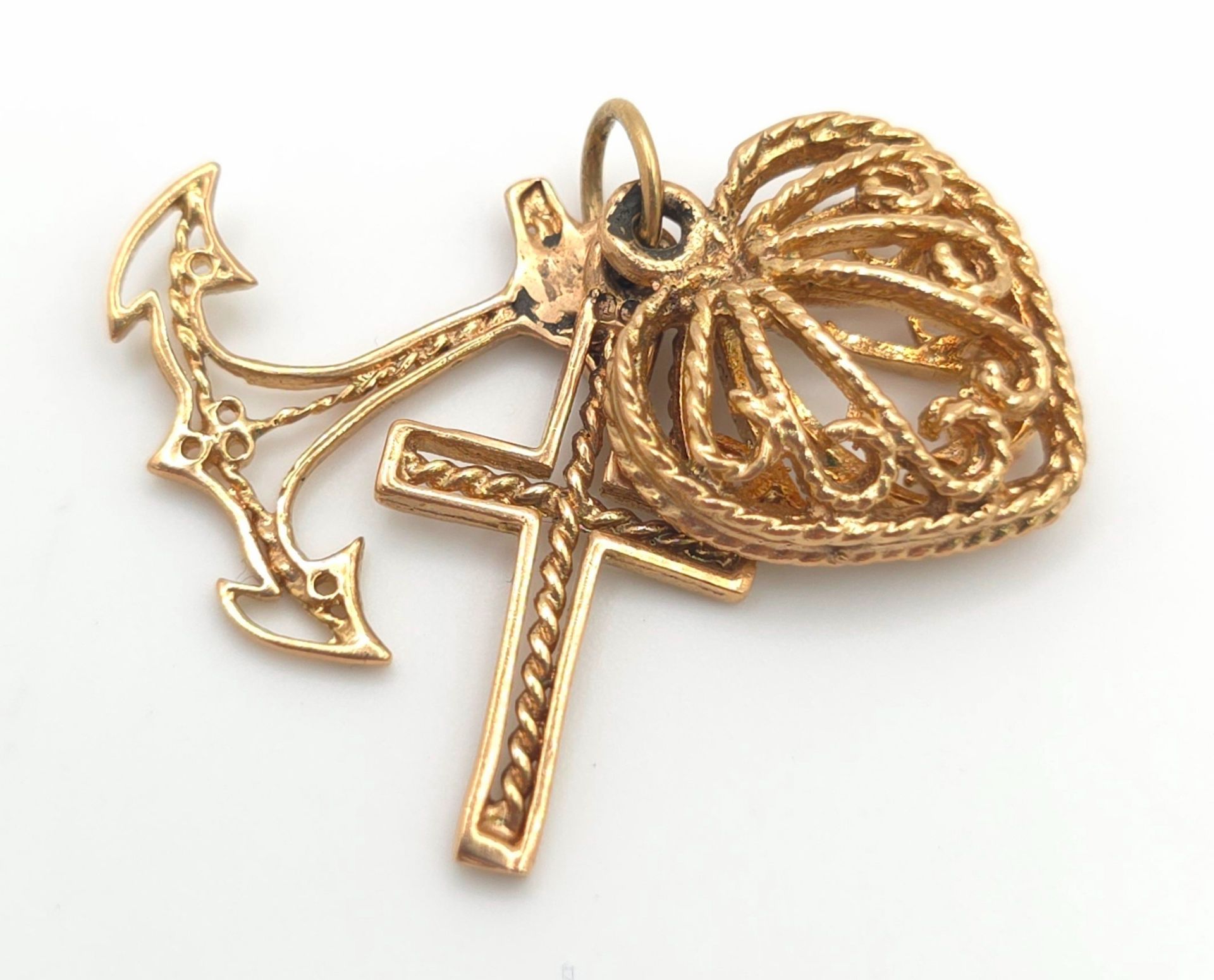 For the lady who loves priests and sailors! An antique, 9 K rose gold triple pendant with a heart,