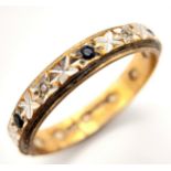 An antique 9 K yellow gold eternity ring with alternating old cut diamonds and sapphires. Ring size: