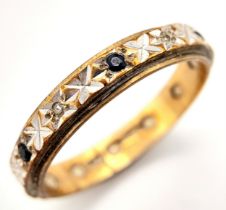 An antique 9 K yellow gold eternity ring with alternating old cut diamonds and sapphires. Ring size: