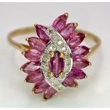 A 9K YELLOW GOLD DIAMOND AND RUBY FANCY SPIRAL CLUSTER RING. 3G. SIZE U.