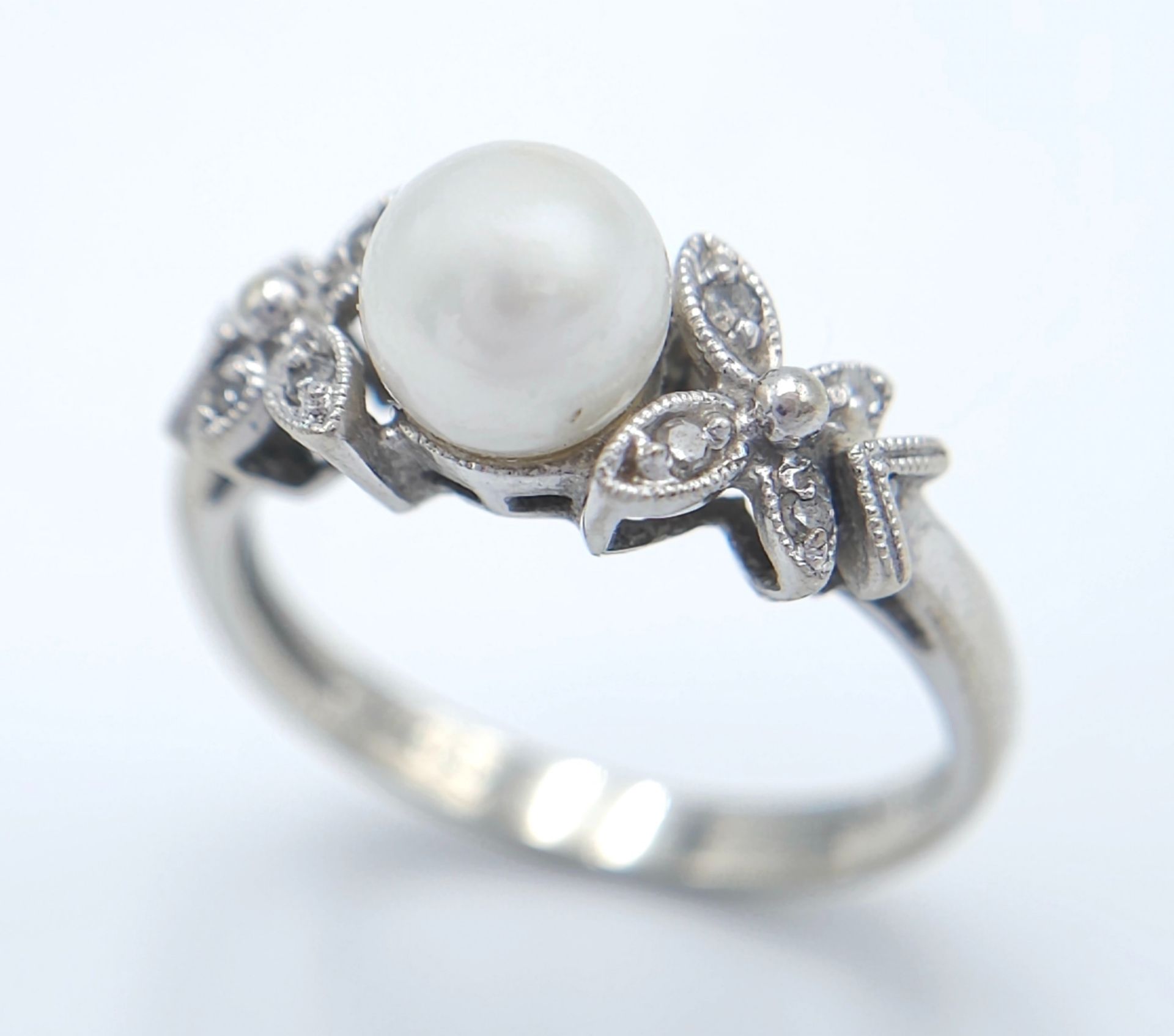 A 14K White Gold, Pearl and Diamond Ring. Central pearl with diamond accents. Size L 1/2. 2.5g total - Image 2 of 6