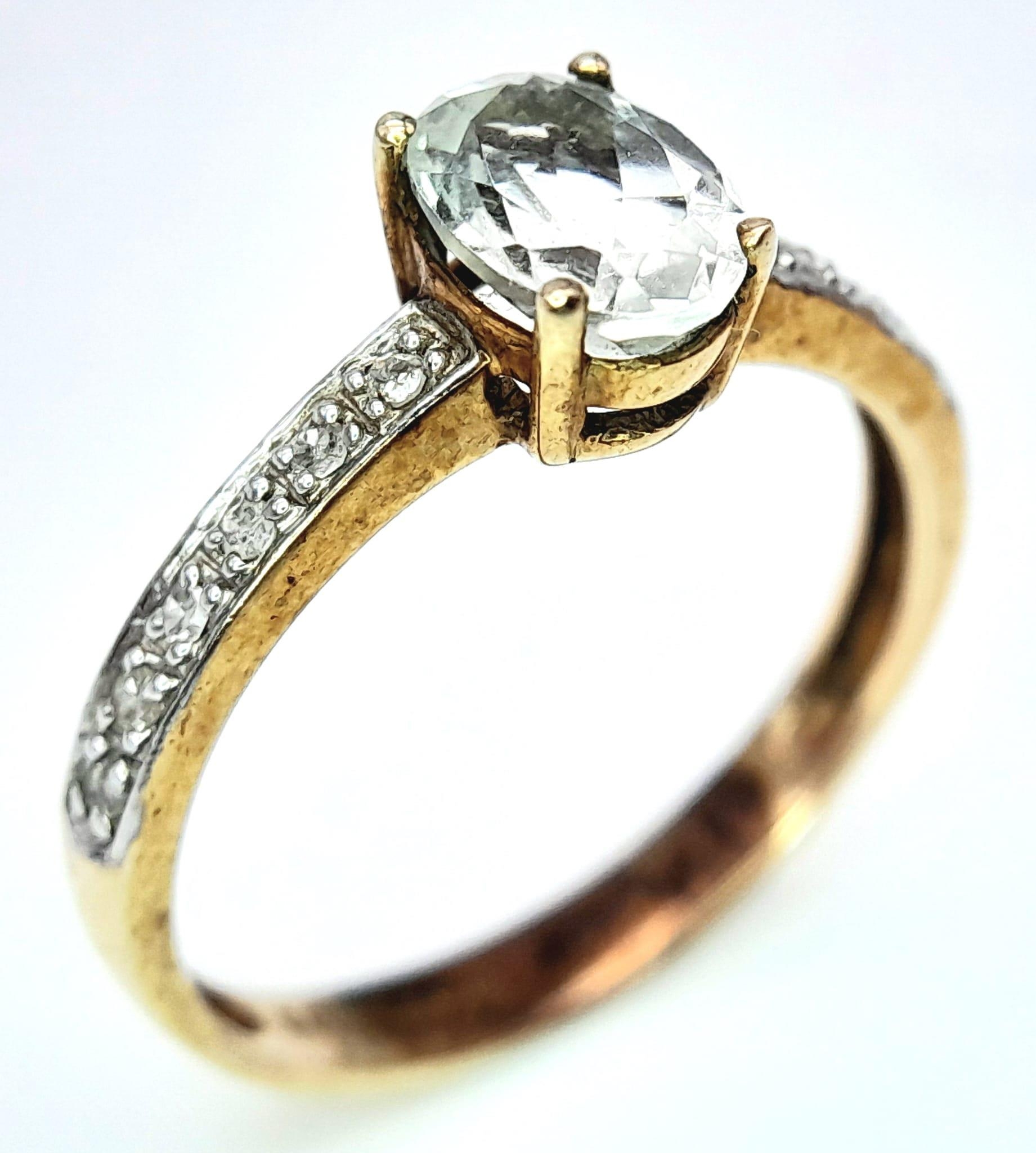 A 9K YELLOW GOLD DIAMOND & AQUAMARINE SET RING. OVAL AQUAMARINE GEMSTONE APPROX 0.75CT. 1.8G. SIZE N - Image 4 of 6