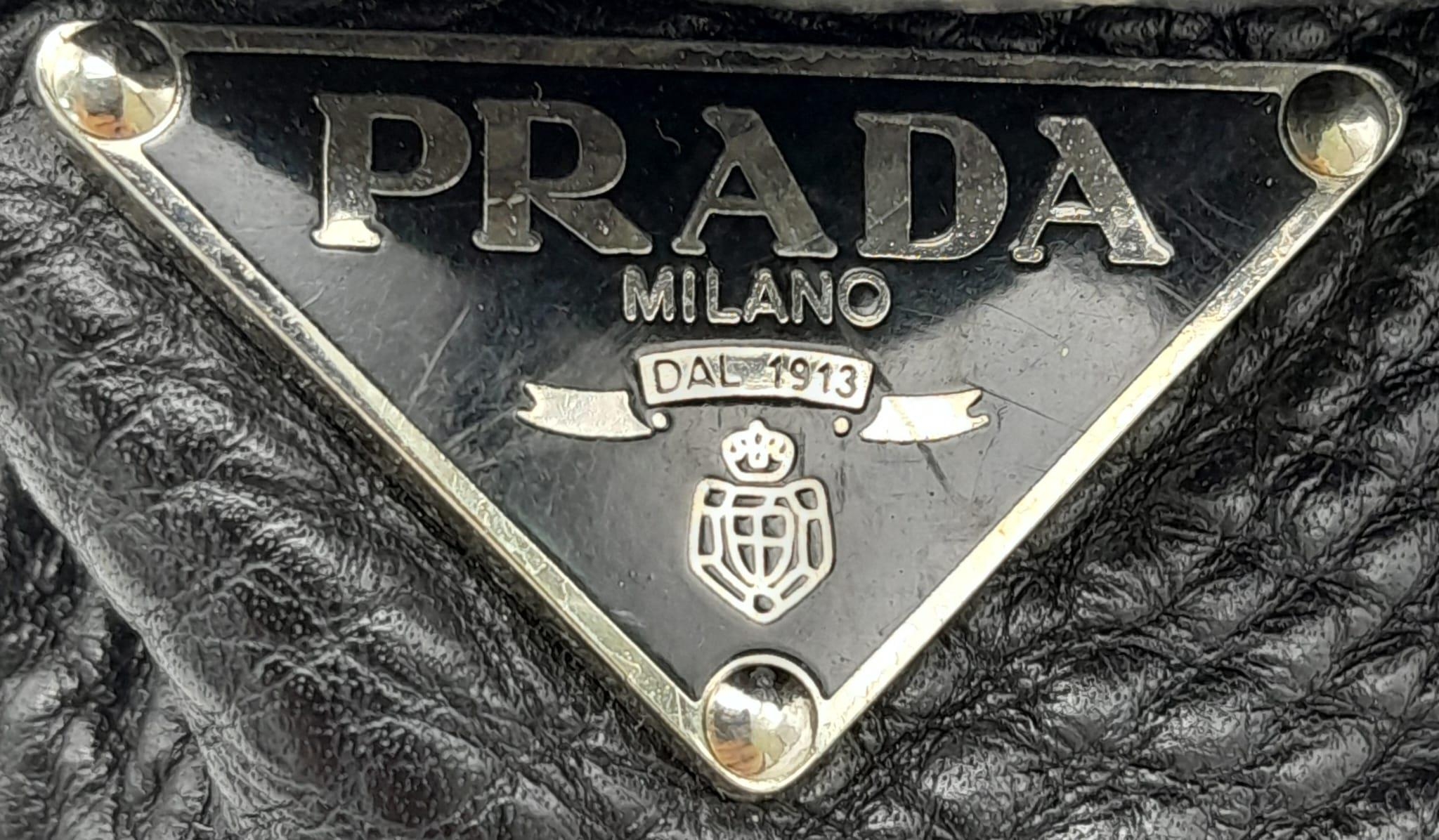 A Prada Black Vitello Shoulder Bag. Leather exterior with silver-toned hardware, two straps, push - Image 8 of 10