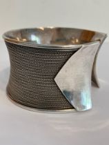 SILVER CUFF BANGLE. Wide and chunky with herringbone inlaid design. Marking for 925 Silver BA.