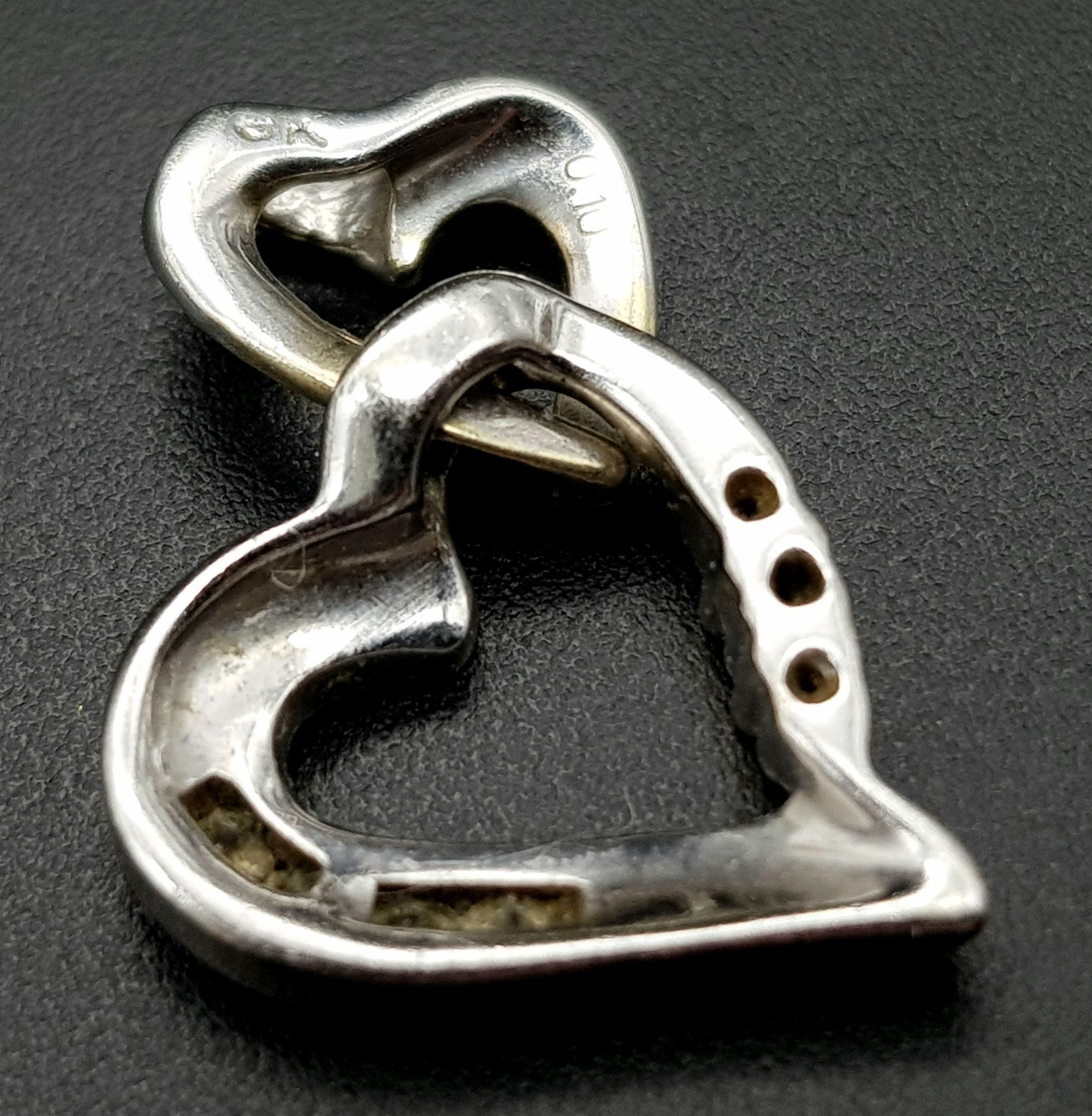 A 9K WHITE GOLD DIAMOND SET DOUBLE HEART PENDANT. 2cm length, 1.6g total weight. Ref: SC 8035 - Image 2 of 5