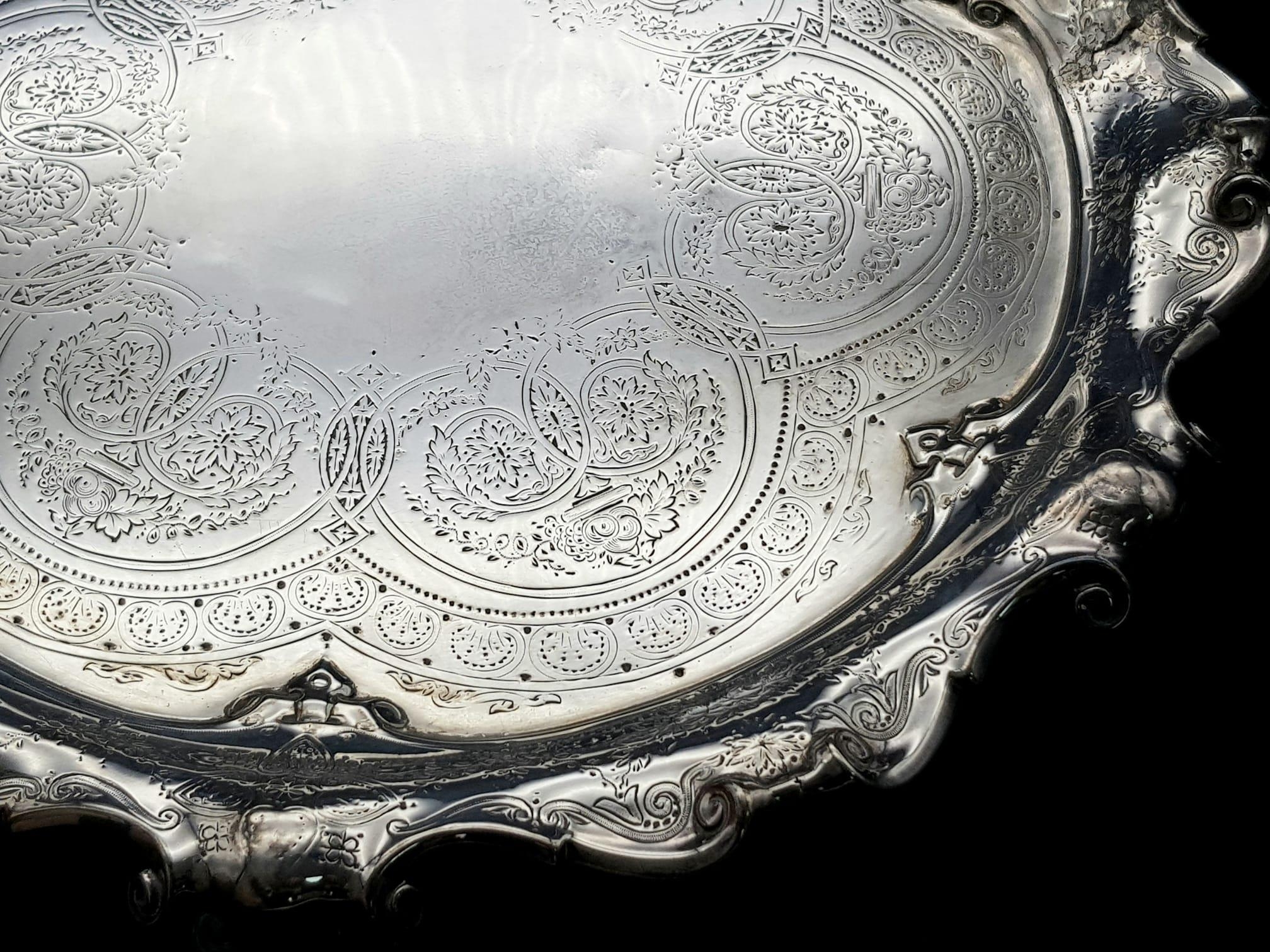 A 761gms solid silver Salva with scrolled edges and hand chased intricate decoration and - Image 3 of 6