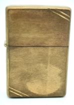 A Vintage Brass Zippo Lighter. USA Made. Marked IX and Engine Turned Detail. Comes with Vintage