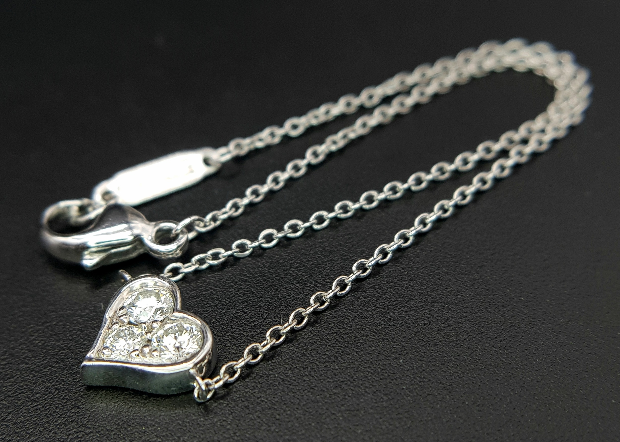 A 950 Platinum Delicate Tiffany and Co. Diamond Heart Bracelet. 16cm. 2.35g total weight. Ref: - Image 2 of 7