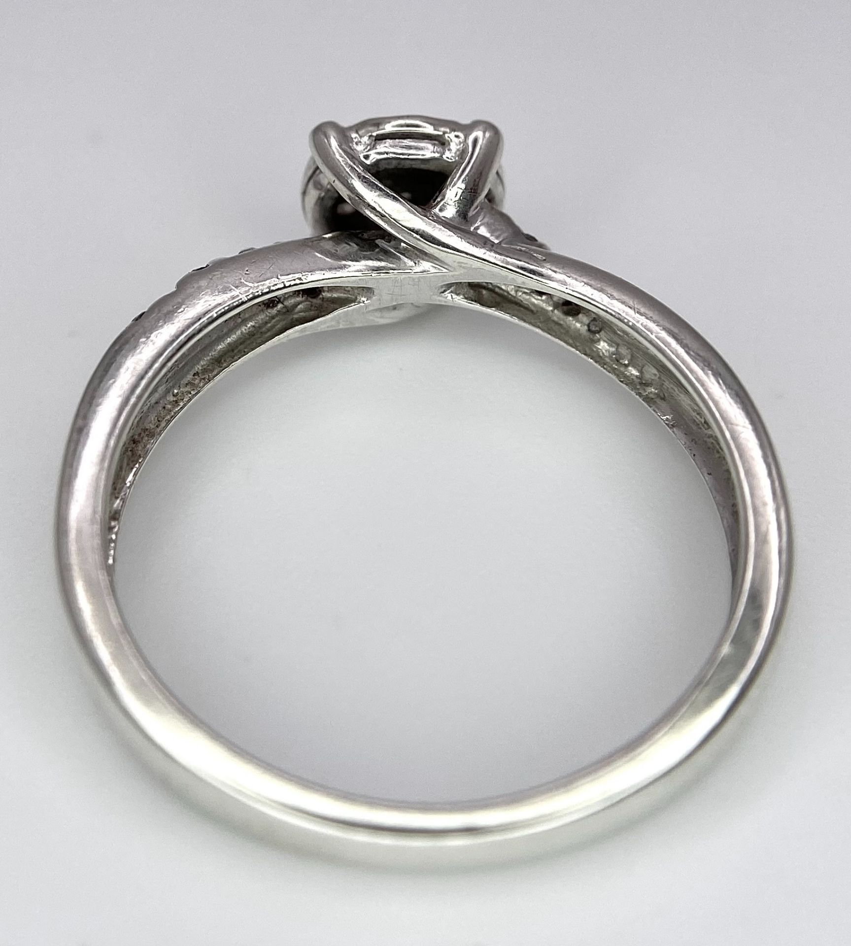 A 9K White Gold Diamond Cluster Ring. Seven small diamonds on a circular base with diamonds on - Image 6 of 6
