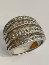 Beautiful SILVER FOUR BAND RING . Heavily encrusted with sparkling zirconia baguettes .Complete with