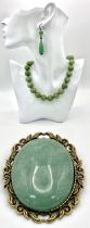 A Suite of Jade Jewellery. Includes bead necklace, earrings and brooch.