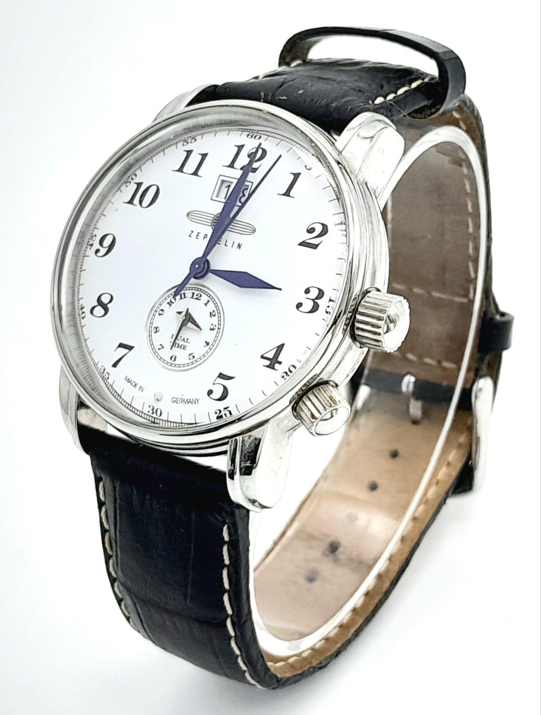 A German Made Zeppelin Dual Time Gents Quartz Watch. Black leather strap. Stainless steel case -