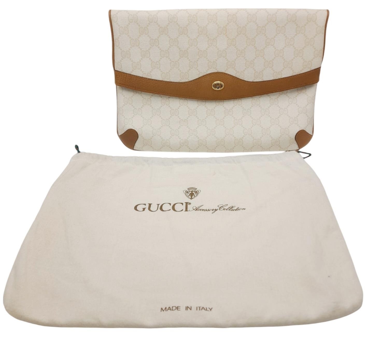 A Gucci Ivory GG Monogram Clutch Bag. Leather exterior with brown trim, gold and silver-toned GG, - Image 2 of 10