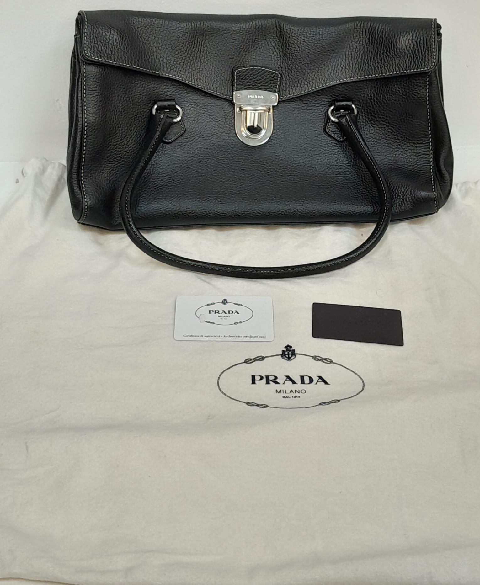 A Prada Black Shoulder Bag. Leather exterior with silver-toned hardware, two rolled leather - Image 7 of 7