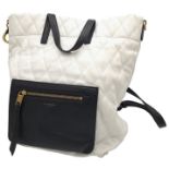 A Givenchy Black and White Duo Backpack. Quilted leather exterior with gold-toned hardware, a zipped